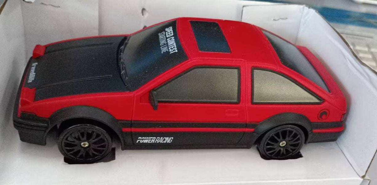 4WD RC Drift Car in red and black with a sporty hatchback body, dark windows, racing stripes and black wheels