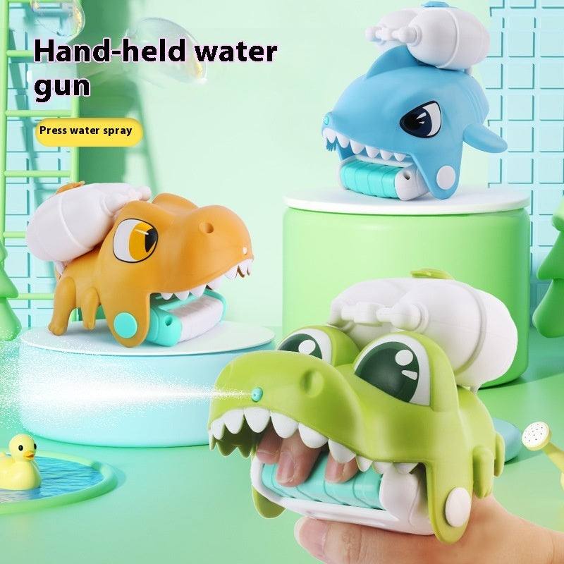 Animal Wrist Water Gun in blue, orange and green animal-shaped designs with cartoon eyes, teeth and white pump tops