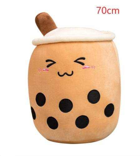 Bubble Tea Plush Pillow in caramel-brown plush with a white lid, brown straw, black tapioca dots and embroidered smiling face