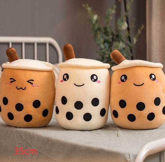 Bubble Tea Plush Pillow in three cream and caramel cup designs with embroidered faces, white lids, straws and black tapioca dots