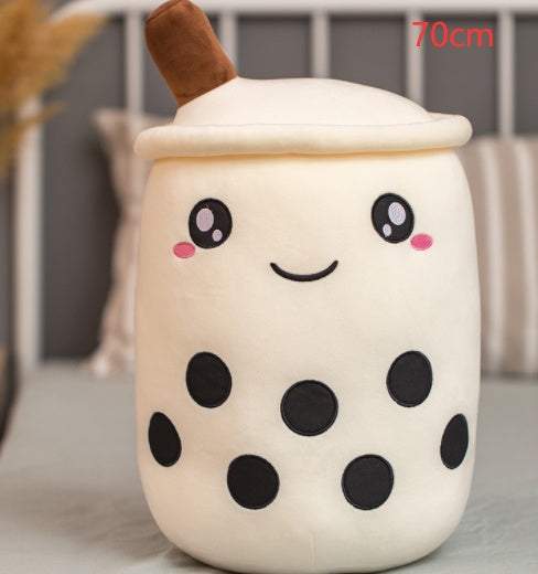 Bubble Tea Plush Pillow in cream plush with brown straw, black tapioca pearls, and a cute embroidered smiling face