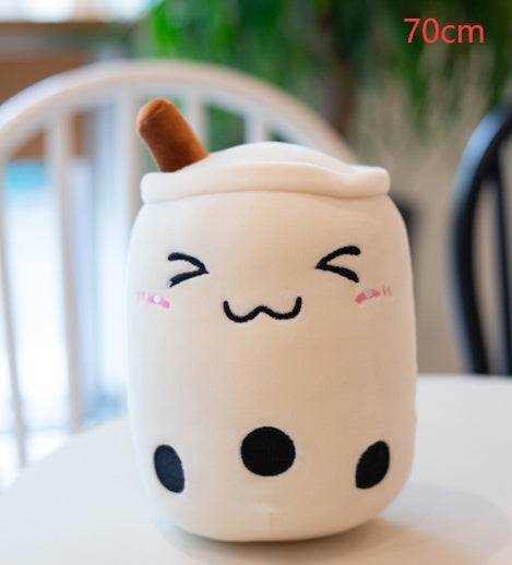 Bubble Tea Plush Pillow in cream short plush with a brown straw, smiling embroidered face, and black tapioca pearls