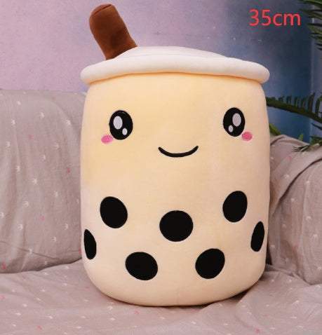 Bubble Tea Plush Pillow in cream plush fabric, shaped like a smiling cup with black tapioca pearls, a white lid, and brown straw