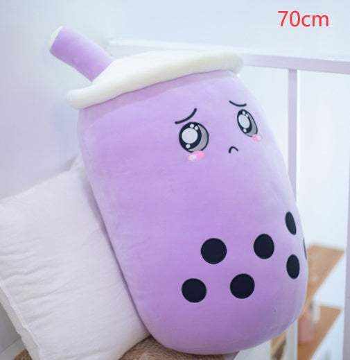 Bubble Tea Plush Pillow in lavender plush fabric, with a white lid, purple straw, embroidered teary eyes and black tapioca pearls