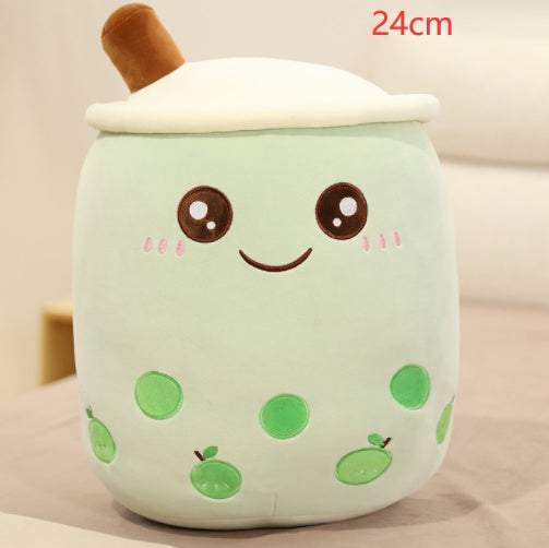 Bubble Tea Plush Pillow in pale mint-green plush with a white lid, brown straw, embroidered face, and green tapioca pearls