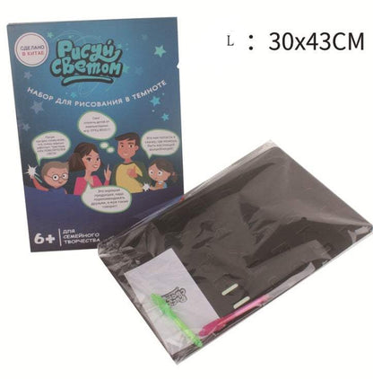 3D Magic Light-Up Drawing Pad set with a black plastic drawing board, colorful light pen, and illustrated blue packaging