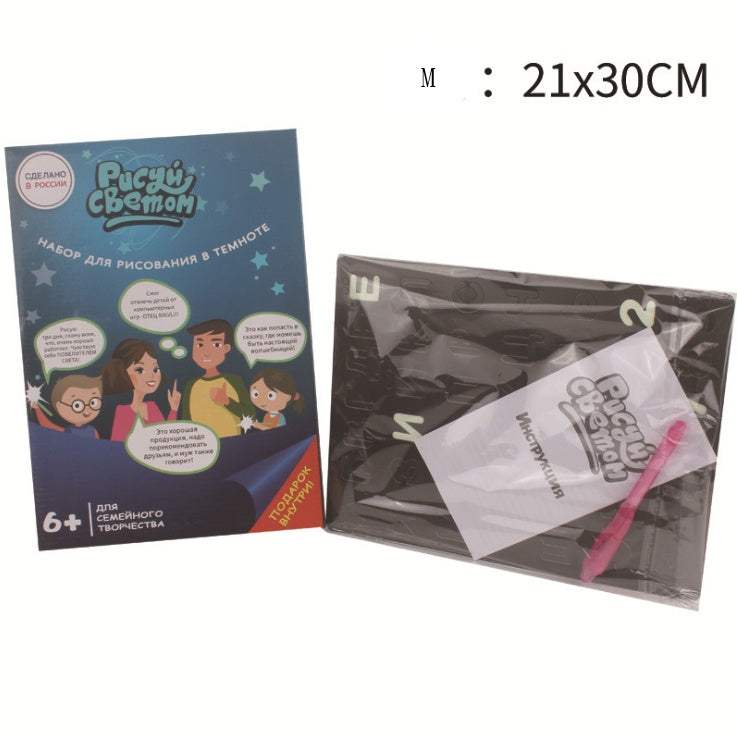 3D Magic Light-Up Drawing Pad with a black plastic luminous board, pink light pen and colorful illustrated packaging