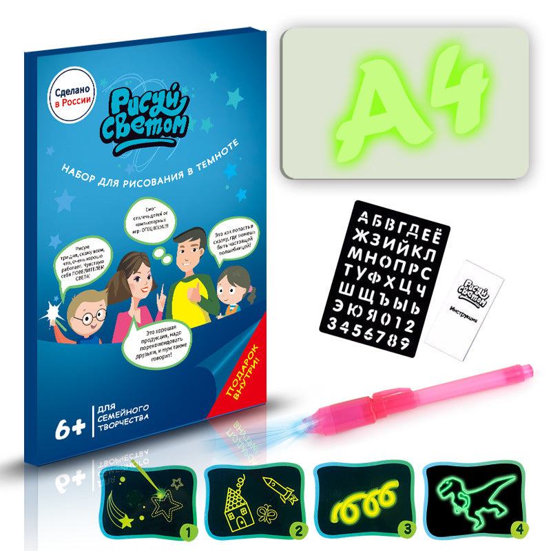 3D Magic Light-Up Drawing Pad set with blue packaging, translucent pink light pen, black letter template and bright green glowing letters