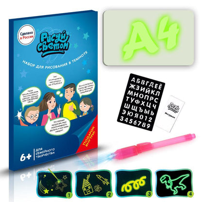 3D Magic Light-Up Drawing Pad set with blue packaging, translucent pink light pen, black letter template and bright green glowing letters