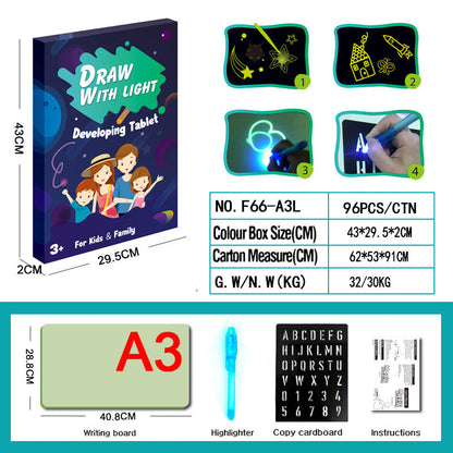 3D Magic Light-Up Drawing Pad with a clear plastic drawing board, blue light pen and letter tracing template