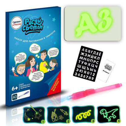 3D Magic Light-Up Drawing Pad with a glowing green A3 panel, black letter stencil, pink light pen and drawing templates