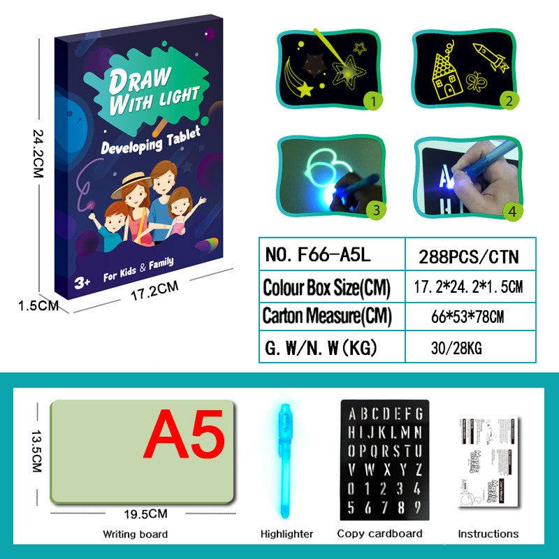 3D Magic Light-Up Drawing Pad with a green plastic board, blue light pen and letter template for glowing drawings