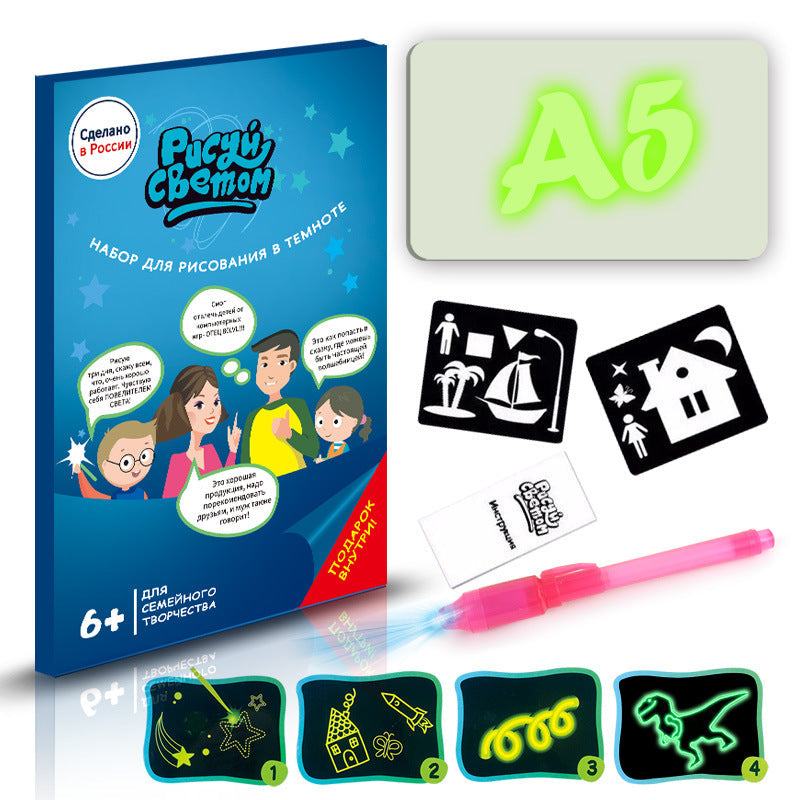 3D Magic Light-Up Drawing Pad with a pale green plastic board, glowing green A5 lettering, pink light pen and templates