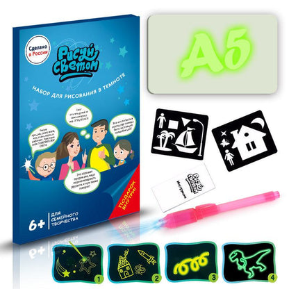 3D Magic Light-Up Drawing Pad with a pale green plastic board, glowing green A5 lettering, pink light pen and templates
