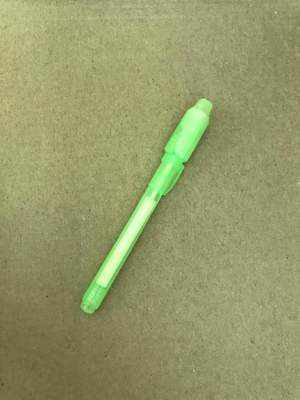 3D Magic Light-Up Drawing Pad with a bright lime green plastic light pen and tapered tip