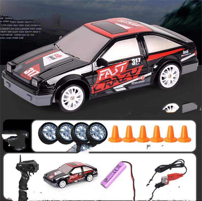 4WD RC Drift Car in black and red with racing graphics, white wheels, four-wheel drive styling and a remote control