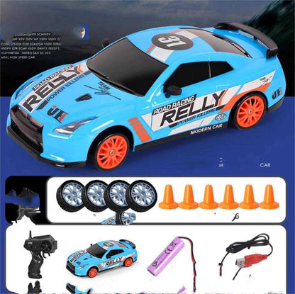 4WD RC Drift Car in bright blue with orange wheels, racing decals, black windows and a rear spoiler