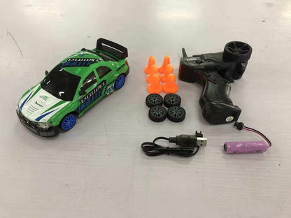 4WD RC Drift Car with green, white and blue racing graphics, glossy body, black spoiler and included remote control