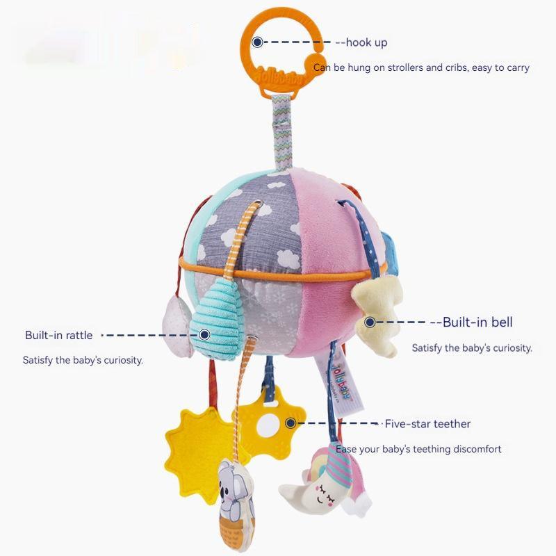 Baby Car Seat Hanging Toy in pastel patchwork fabric with cloud prints, orange hanging ring, rattle, bell and teether charms