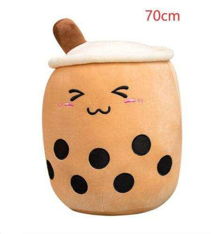 Bubble Tea Plush Pillow in caramel-brown plush with a white lid, brown straw, black tapioca dots and embroidered smiling face