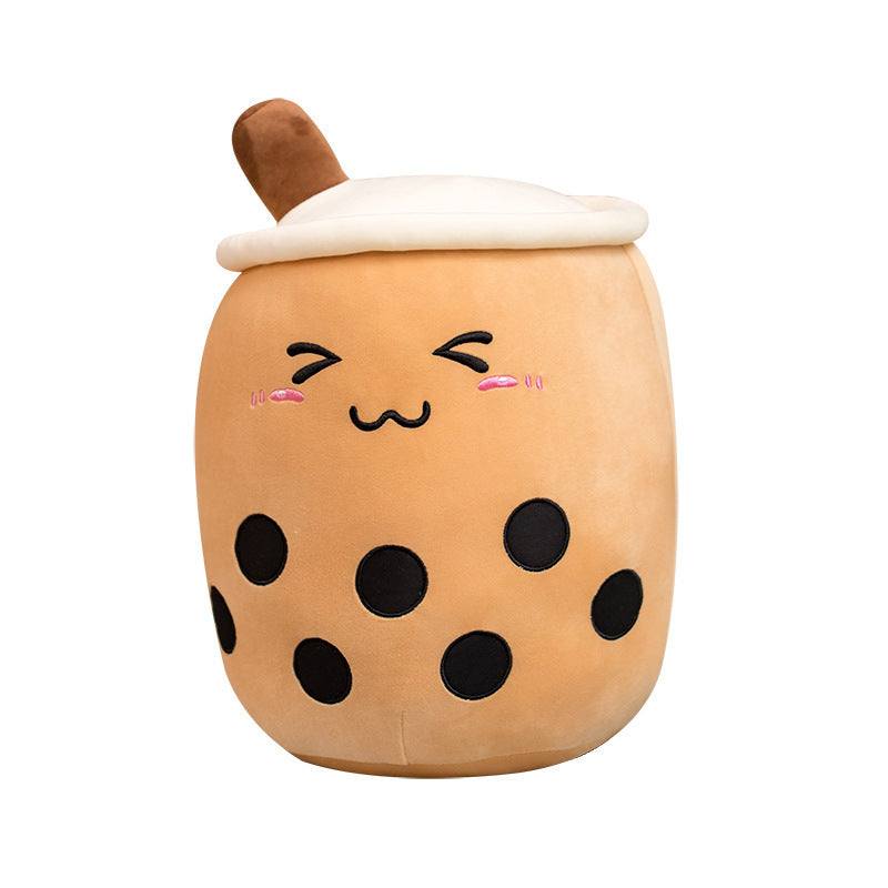 Bubble Tea Plush Pillow in caramel-brown short plush, with black embroidered tapioca pearls, a smiling face, and white whipped-cream top