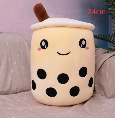 Bubble Tea Plush Pillow in cream plush with black tapioca dots, embroidered smiling face, white lid and brown straw