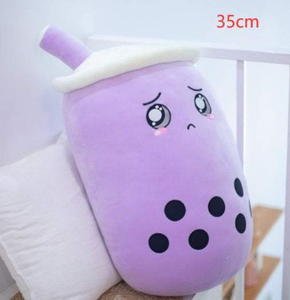 Bubble Tea Plush Pillow in lavender short plush, with black tapioca dots, embroidered teary eyes, a white lid and straw