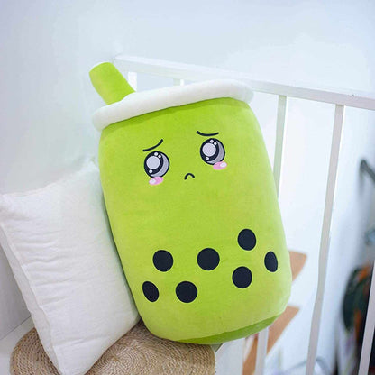 Bubble Tea Plush Pillow in bright lime green plush fabric, with a white lid, green straw, embroidered face and black tapioca dots