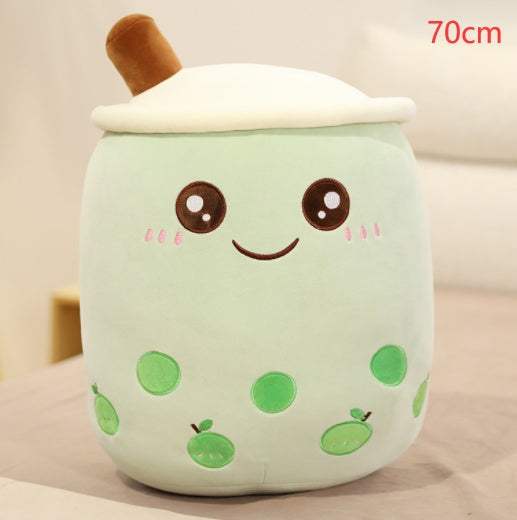 Bubble Tea Plush Pillow in pale mint green with embroidered smiling face, green tapioca pearls, white lid and brown straw