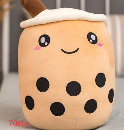 Bubble Tea Plush Pillow in peach plush with a white cream top, brown straw, smiling face and black tapioca pearls