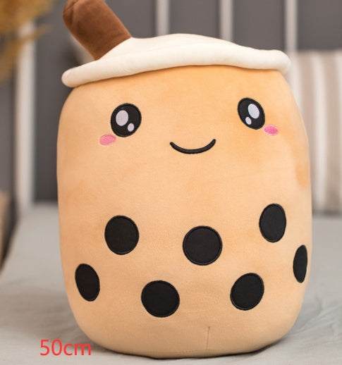 Bubble Tea Plush Pillow in peachy tan plush with a white foam top, brown straw, embroidered smile and black tapioca dots