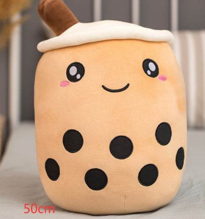 Bubble Tea Plush Pillow in peachy tan plush with a white foam top, brown straw, embroidered smile and black tapioca dots