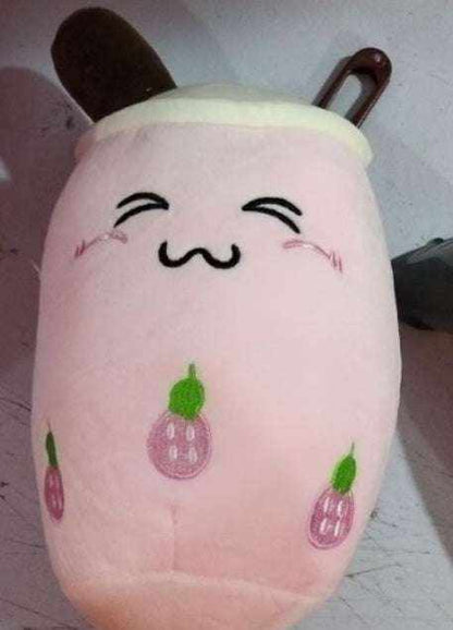 Bubble Tea Plush Pillow in soft pink plush with white lid, brown straw and embroidered smiling face and purple fruit motifs