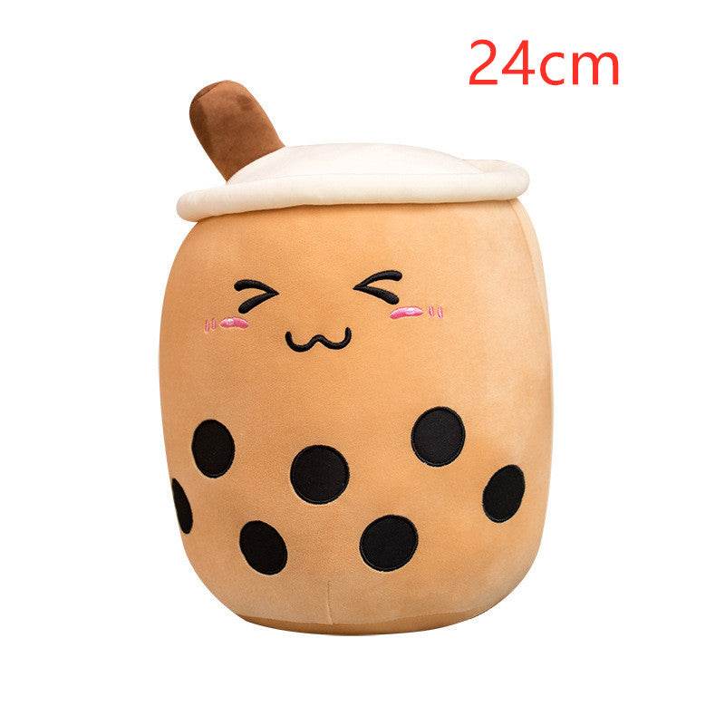 Bubble Tea Plush Pillow in tan short plush with black tapioca spots, a white lid, brown straw, and embroidered smiling face