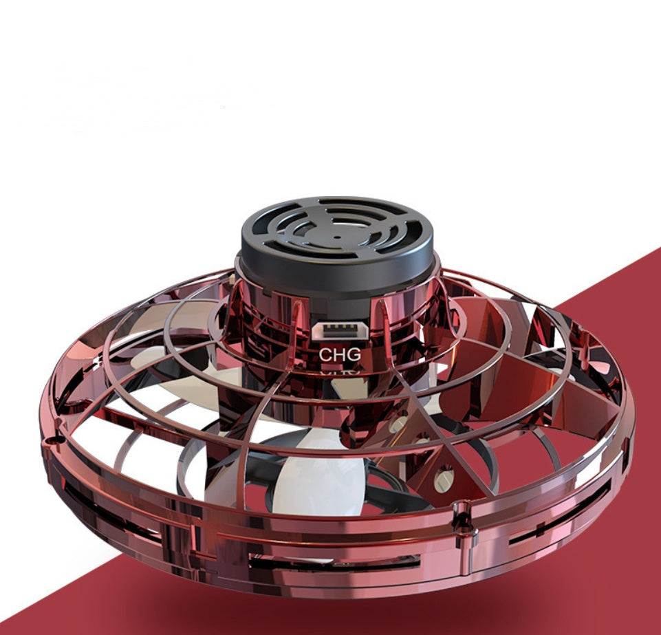 LED Fingertip Gyro Spinner Toy with a transparent red-tinted plastic cage, black top, and visible charging label