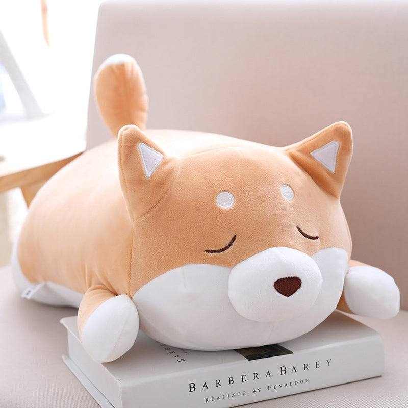 Shiba Inu Plush Toy in soft orange and white plush, with a round body, curled tail, pointed ears and sleepy face