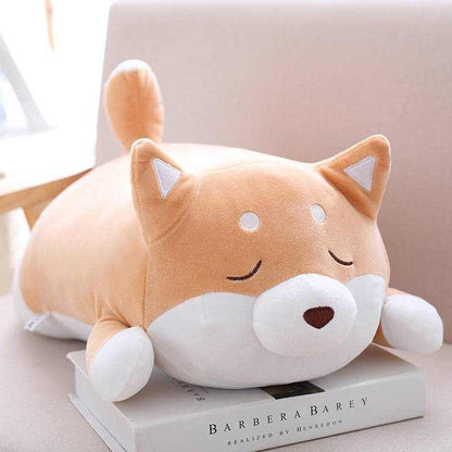 Shiba Inu Plush Toy in soft orange and white plush, with a round body, curled tail, pointed ears and sleepy face