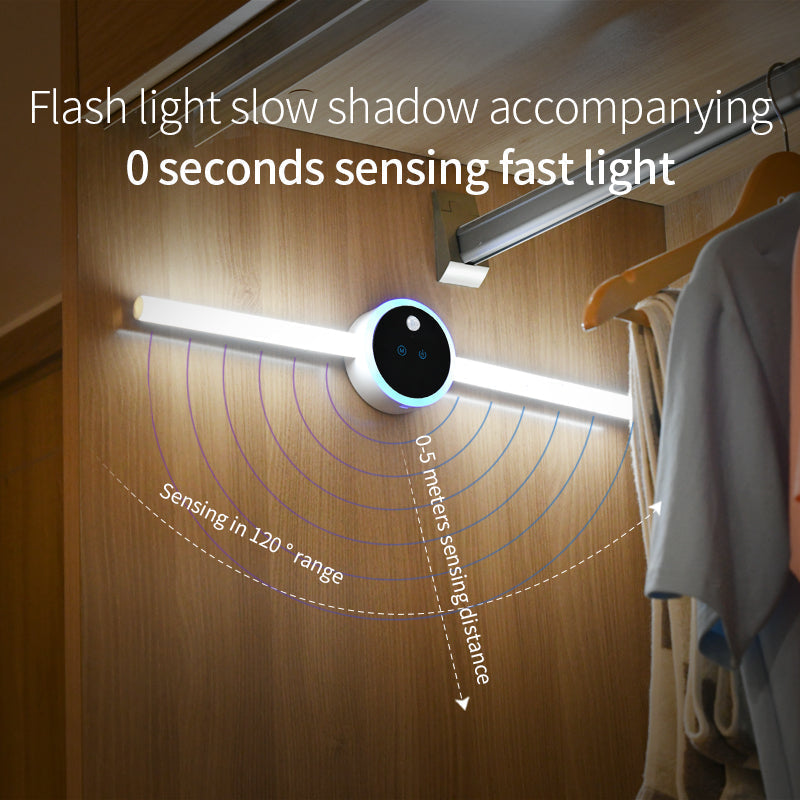 Smart LED Cabinet Light with a slim white tube and central black motion sensor, shown illuminated inside a wardrobe