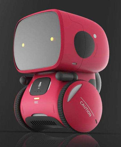 Voice Recognition Robot Toy in bright pink with a gray screen face, black wheels, microphone button, and caution-marked side panel