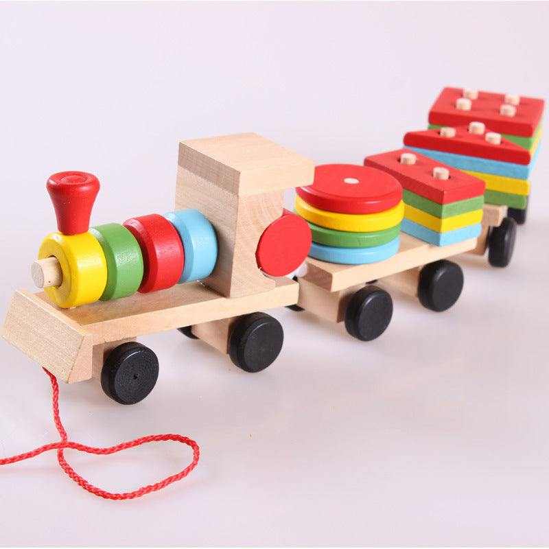 Wooden Train Tractor Puzzle Toy in natural wood with brightly colored stacking blocks, red pull cord and black wheels.