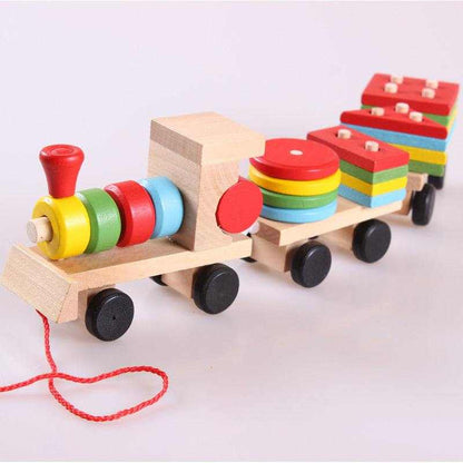 Wooden Train Tractor Puzzle Toy in natural wood with brightly colored stacking blocks, red pull cord and black wheels.